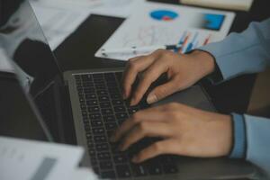 Financial Business team present. Business man hands hold documents with financial statistic stock photo, discussion, and analysis report data the charts and graphs. Finance Financial concept photo