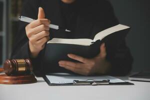 female lawyers working at the law firms. Judge gavel with scales of justice. Legal law, lawyer, advice and justice concept. photo