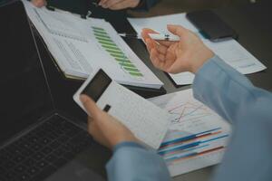 Financial Business team present. Business man hands hold documents with financial statistic stock photo, discussion, and analysis report data the charts and graphs. Finance Financial concept photo