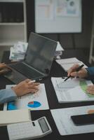 Financial Business team present. Business man hands hold documents with financial statistic stock photo, discussion, and analysis report data the charts and graphs. Finance Financial concept photo