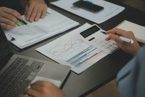 Financial Business team present. Business man hands hold documents with financial statistic stock photo, discussion, and analysis report data the charts and graphs. Finance Financial concept photo