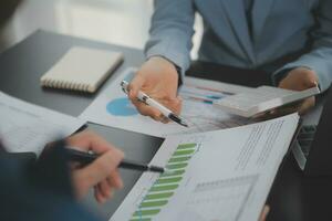 Financial Business team present. Business man hands hold documents with financial statistic stock photo, discussion, and analysis report data the charts and graphs. Finance Financial concept photo