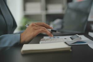 Financial Business team present. Business man hands hold documents with financial statistic stock photo, discussion, and analysis report data the charts and graphs. Finance Financial concept photo
