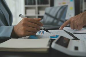 Financial Business team present. Business man hands hold documents with financial statistic stock photo, discussion, and analysis report data the charts and graphs. Finance Financial concept photo