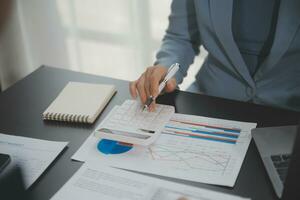 Financial Business team present. Business man hands hold documents with financial statistic stock photo, discussion, and analysis report data the charts and graphs. Finance Financial concept photo