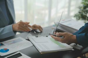 Financial Business team present. Business man hands hold documents with financial statistic stock photo, discussion, and analysis report data the charts and graphs. Finance Financial concept photo