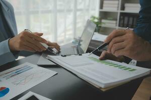 Financial Business team present. Business man hands hold documents with financial statistic stock photo, discussion, and analysis report data the charts and graphs. Finance Financial concept photo