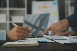 Financial Business team present. Business man hands hold documents with financial statistic stock photo, discussion, and analysis report data the charts and graphs. Finance Financial concept photo
