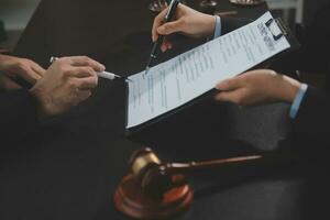 female lawyers working at the law firms. Judge gavel with scales of justice. Legal law, lawyer, advice and justice concept. photo