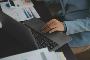 Financial Business team present. Business man hands hold documents with financial statistic stock photo, discussion, and analysis report data the charts and graphs. Finance Financial concept photo
