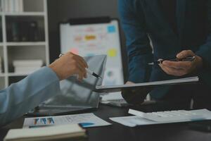 Financial Business team present. Business man hands hold documents with financial statistic stock photo, discussion, and analysis report data the charts and graphs. Finance Financial concept photo