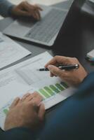 Financial Business team present. Business man hands hold documents with financial statistic stock photo, discussion, and analysis report data the charts and graphs. Finance Financial concept photo