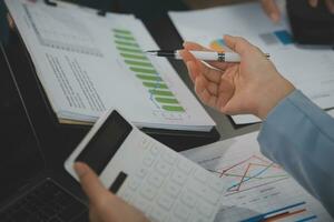 Financial Business team present. Business man hands hold documents with financial statistic stock photo, discussion, and analysis report data the charts and graphs. Finance Financial concept photo