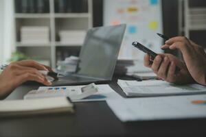 Financial Business team present. Business man hands hold documents with financial statistic stock photo, discussion, and analysis report data the charts and graphs. Finance Financial concept photo