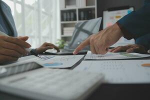 Financial Business team present. Business man hands hold documents with financial statistic stock photo, discussion, and analysis report data the charts and graphs. Finance Financial concept photo
