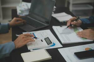 Financial Business team present. Business man hands hold documents with financial statistic stock photo, discussion, and analysis report data the charts and graphs. Finance Financial concept photo