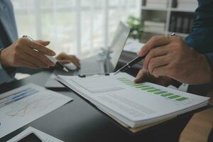 Financial Business team present. Business man hands hold documents with financial statistic stock photo, discussion, and analysis report data the charts and graphs. Finance Financial concept photo