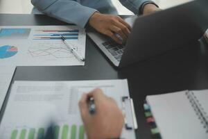 Financial Business team present. Business man hands hold documents with financial statistic stock photo, discussion, and analysis report data the charts and graphs. Finance Financial concept photo