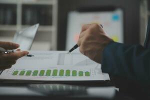 Financial Business team present. Business man hands hold documents with financial statistic stock photo, discussion, and analysis report data the charts and graphs. Finance Financial concept photo
