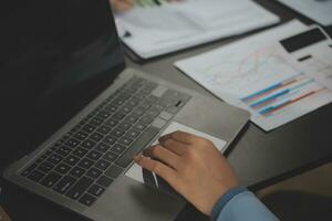 Financial Business team present. Business man hands hold documents with financial statistic stock photo, discussion, and analysis report data the charts and graphs. Finance Financial concept photo
