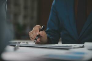 Financial Business team present. Business man hands hold documents with financial statistic stock photo, discussion, and analysis report data the charts and graphs. Finance Financial concept photo