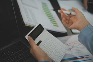 Financial Business team present. Business man hands hold documents with financial statistic stock photo, discussion, and analysis report data the charts and graphs. Finance Financial concept photo