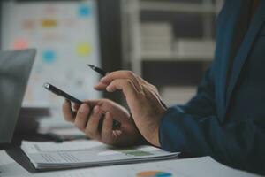Financial Business team present. Business man hands hold documents with financial statistic stock photo, discussion, and analysis report data the charts and graphs. Finance Financial concept photo