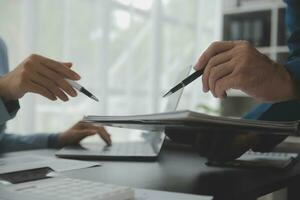 Financial Business team present. Business man hands hold documents with financial statistic stock photo, discussion, and analysis report data the charts and graphs. Finance Financial concept photo