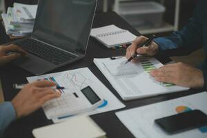 Financial Business team present. Business man hands hold documents with financial statistic stock photo, discussion, and analysis report data the charts and graphs. Finance Financial concept photo