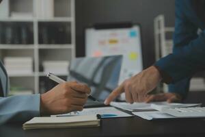 Financial Business team present. Business man hands hold documents with financial statistic stock photo, discussion, and analysis report data the charts and graphs. Finance Financial concept photo