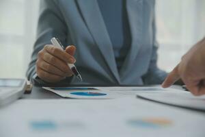 Financial Business team present. Business man hands hold documents with financial statistic stock photo, discussion, and analysis report data the charts and graphs. Finance Financial concept photo