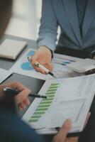 Financial Business team present. Business man hands hold documents with financial statistic stock photo, discussion, and analysis report data the charts and graphs. Finance Financial concept photo