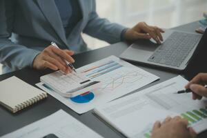 Financial Business team present. Business man hands hold documents with financial statistic stock photo, discussion, and analysis report data the charts and graphs. Finance Financial concept photo