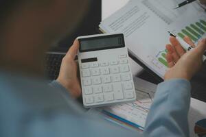 Financial Business team present. Business man hands hold documents with financial statistic stock photo, discussion, and analysis report data the charts and graphs. Finance Financial concept photo