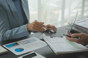 Financial Business team present. Business man hands hold documents with financial statistic stock photo, discussion, and analysis report data the charts and graphs. Finance Financial concept photo