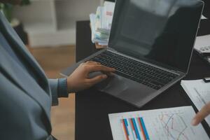 Financial Business team present. Business man hands hold documents with financial statistic stock photo, discussion, and analysis report data the charts and graphs. Finance Financial concept photo