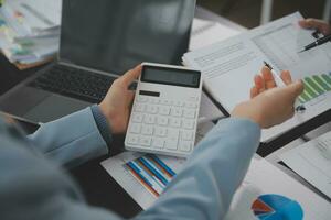 Financial Business team present. Business man hands hold documents with financial statistic stock photo, discussion, and analysis report data the charts and graphs. Finance Financial concept photo