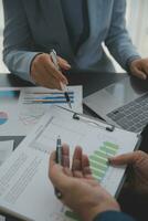 Financial Business team present. Business man hands hold documents with financial statistic stock photo, discussion, and analysis report data the charts and graphs. Finance Financial concept photo
