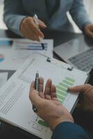 Financial Business team present. Business man hands hold documents with financial statistic stock photo, discussion, and analysis report data the charts and graphs. Finance Financial concept photo
