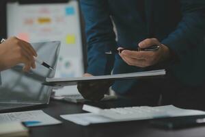 Financial Business team present. Business man hands hold documents with financial statistic stock photo, discussion, and analysis report data the charts and graphs. Finance Financial concept photo