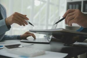 Financial Business team present. Business man hands hold documents with financial statistic stock photo, discussion, and analysis report data the charts and graphs. Finance Financial concept photo
