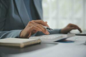Financial Business team present. Business man hands hold documents with financial statistic stock photo, discussion, and analysis report data the charts and graphs. Finance Financial concept photo