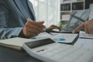 Financial Business team present. Business man hands hold documents with financial statistic stock photo, discussion, and analysis report data the charts and graphs. Finance Financial concept photo