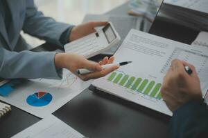 Financial Business team present. Business man hands hold documents with financial statistic stock photo, discussion, and analysis report data the charts and graphs. Finance Financial concept photo