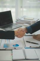 Business handshake for teamwork of business merger and acquisition,successful negotiate,hand shake,two businessman shake hand with partner to celebration partnership and business deal concept photo