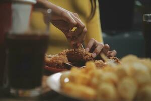 fat woman bite piece of pizza,overweight female is eating fast foods,asian girl is hungry photo