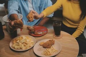 fat woman bite piece of pizza,overweight female is eating fast foods,asian girl is hungry photo