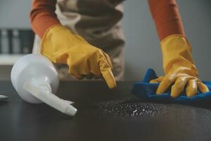 Office Cleaning Service. Janitor Spraying Desk. Workplace Hygiene photo