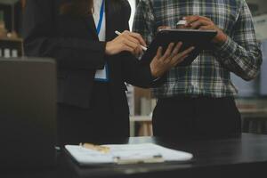 Audit concept,Administrator business man financial inspector and secretary making report calculating balance. Internal Revenue Service checking document. photo