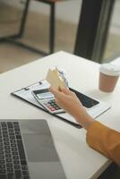 Women holding credit card and using smartphones at home.Online shopping, internet banking, store online, payment, spending money, e-commerce payment at the store, credit card, concept photo